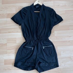 Bebe black satin romper with silver zipper pockets
